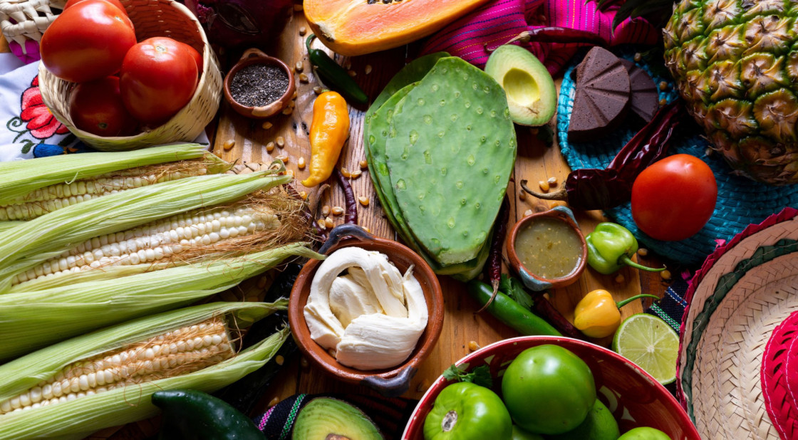 Vibrant Mexican produce display featuring fresh vegetables, fruits, and traditional ingredients for flavorful dishes.